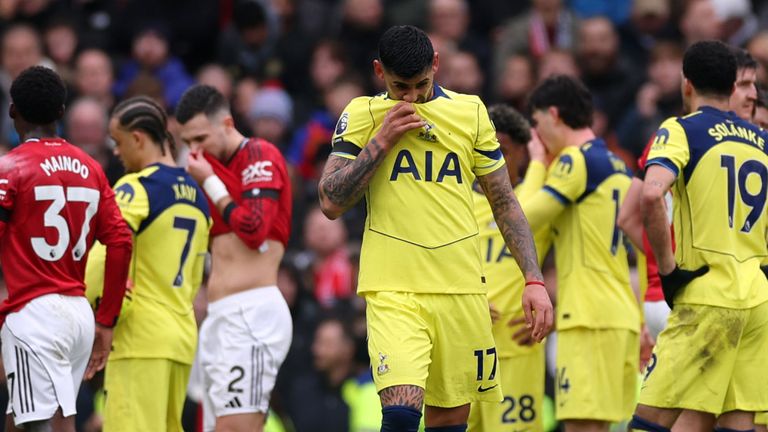 Cristian Romero leaves the field after being shown a red card for a challenge on Casemiro