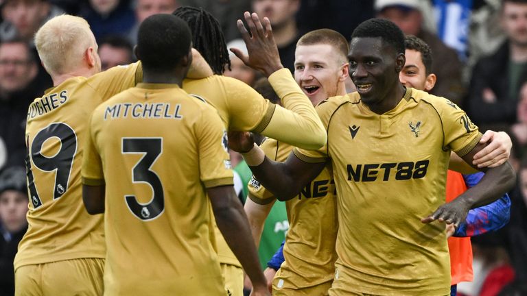 Ismaila Sarr is congratulated by his team-mate after scoring Crystal Palace's opening goal at Brighton
