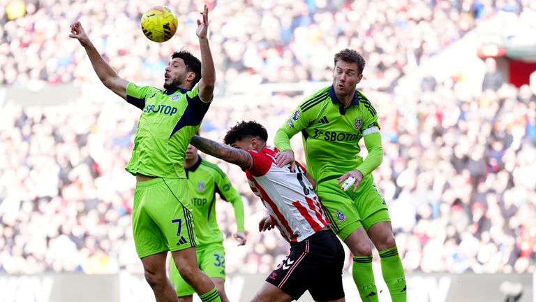 Omar Alderete battles for the ball with Raul Jimenez and Joachim Andersen