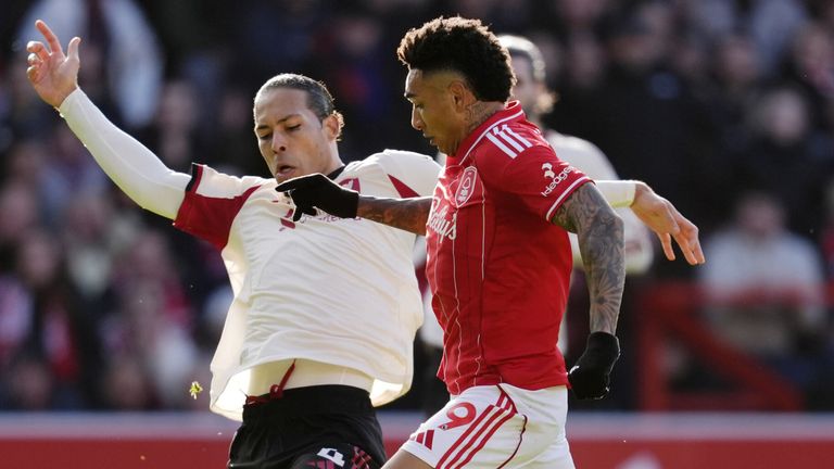 Igor Jesus is tackled by Virgil van Dijk