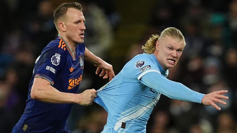 Dan Burn pulls Erling Haaland's shirt