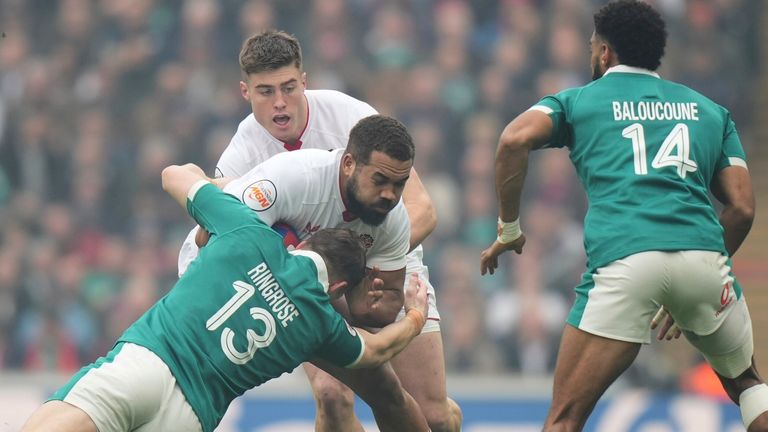 England's Ollie Lawrence is tackled by Ireland's Garry Ringrose