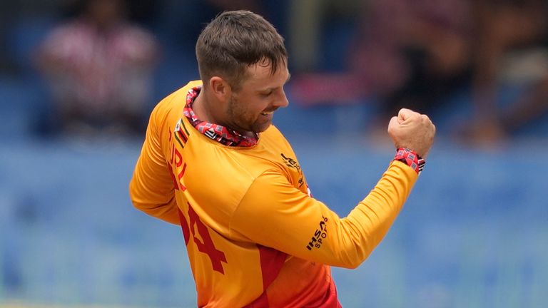 Zimbabwe's Ryan Burl celebrates the wicket of Australia's Glenn Maxwell during the T20 World Cup cricket match between Australia and Zimbabwe in Colombo, Sri Lanka, Friday, Feb. 13, 2026. (AP Photo/Eranga Jayawardena)
