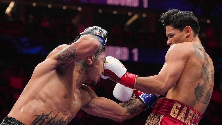 Garcia lands a left hand against Barrios on his way to a dominant win 