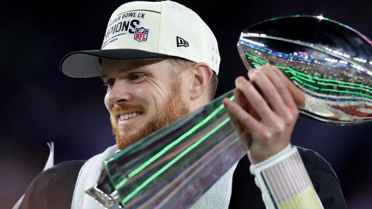 Seattle Seahawks quarterback Sam Darnold holds aloft the Vince Lombardi Trophy after their Super Bowl 60 win over the New England Patriots