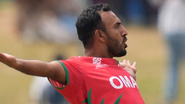Oman's Shakeel Ahamed celebrates the wicket of Ireland's Harry Tector
