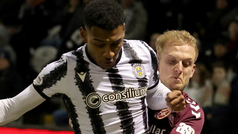 St Mirren's Jayden Richardson and Heart of Midlothian's Harry Milne battle for the ball