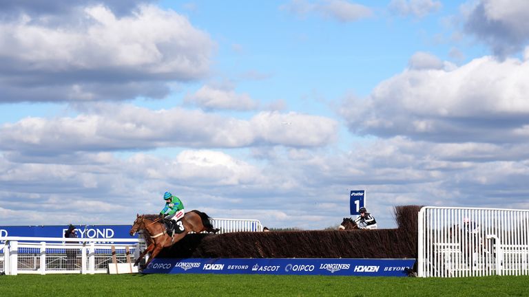 The Jukebox Kid ridden by Ben Jones (left) on their way to winning the  Reynoldstown Novices' Chase at Ascot