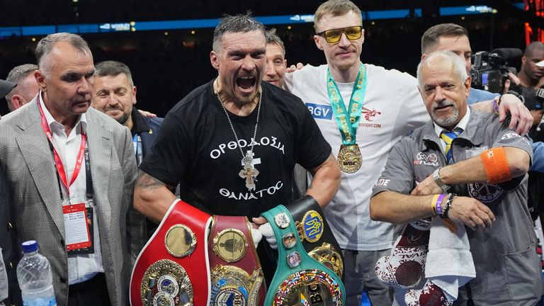 Oleksandr Usyk celebrates after retaining his undisputed world heavyweight boxing titles with victory against Britain's Daniel Dubois at Wembley in July last year (AP Photo/Frank Augstein)