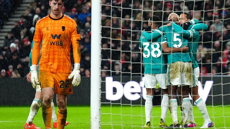 Liverpool's Virgil van Dijk (right) celebrates with team-mates after scoring their side's first goal of the game 