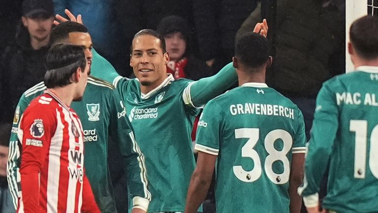 Liverpool's Virgil van Dijk (centre) celebrates scoring their opener