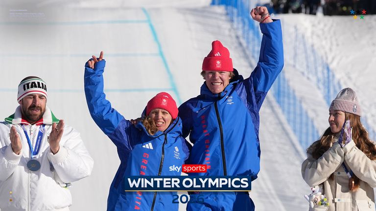 From left, silver medalists Italy's Michela Moioli and Lorenzo Sommariva, gold medalists Britain's Charlotte Bankes and Huw Nightingale, and bronze medalists France's Lea Casta and Loan Bozzolo celebrate after the mixed team snowboard cross finals at the 2026 Winter Olympics, in Livigno, Italy, Sunday, Feb. 15, 2026. (AP Photo/Lindsey Wasson)
