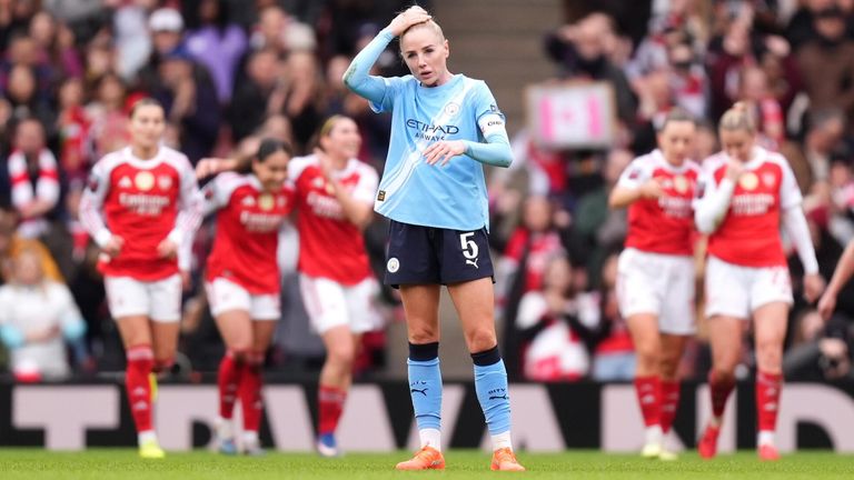 Alex Greenwood looks dejected as Arsenal players celebrate Olivia Smith's opening goal