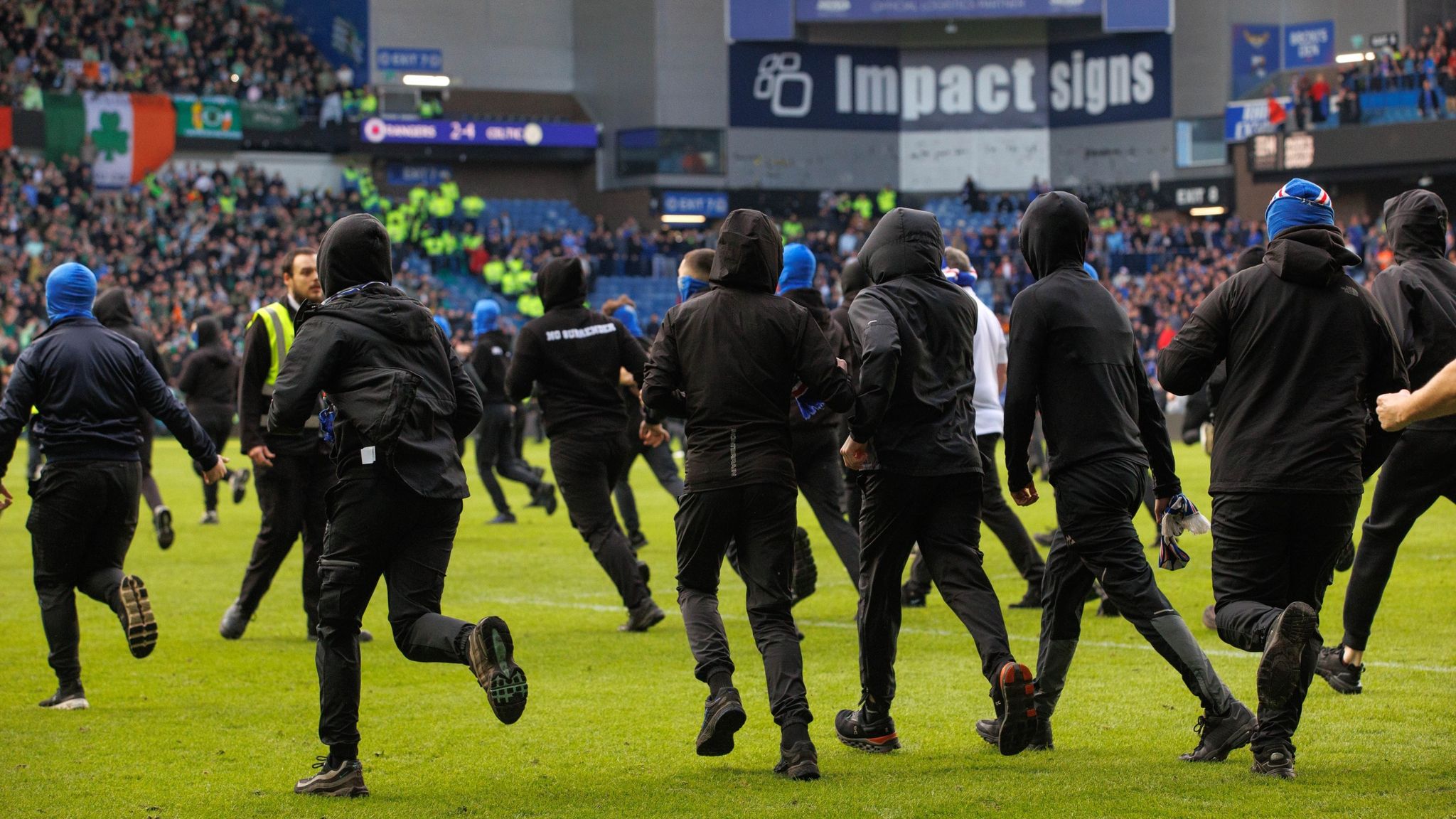 Spectators ran onto the pitch at Ibrox after Celtic beat Rangers
