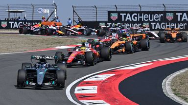 Mercedes' British driver George Russell (front L) leads at the start of the sprint race ahead of the Formula One Chinese Grand Prix at the Shanghai International Circuit in Shanghai on March 14, 2026. (Photo by Jade Gao / AFP)