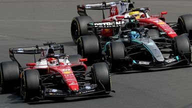Charles Leclerc (L) competes with Mercedes' British driver George Russell (C) and Ferrari's British driver Lewis Hamilton