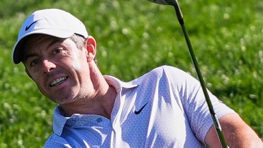Rory McIlroy of Northern Ireland hits from the rough onto the second green during the third round of The Players 