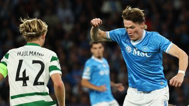 Napoli's Scott McTominay, center,  dribbles against Sporting during a Champions League soccer match, Wednesday, Oct. 1, 202, at Diego Armando Maradona stadium in Naples, Italy. (Alessandro Garofalo//LaPresse via AP)