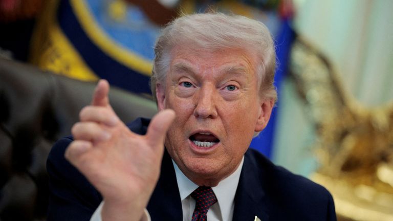 U.S. President Donald Trump reacts as he speaks during the signing ceremony for an executive order on mail ballots, in the Oval Office of th