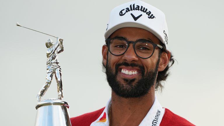 Akshay Bhatia holds the championship trophy after winning the Arnold Palmer Invitational at Bay Hill