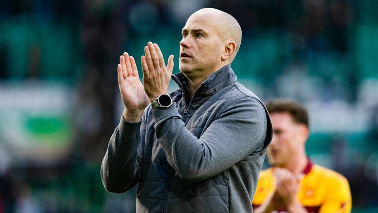 Motherwell manager Jens Berthel Askou applauds fans at full time
