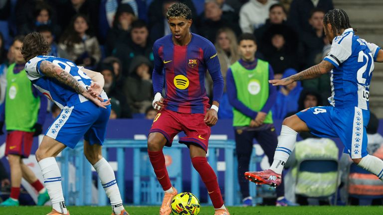 Barcelona's Lamine Yamal controls the ball challenged by Espanyol's Tyrhys Dolan