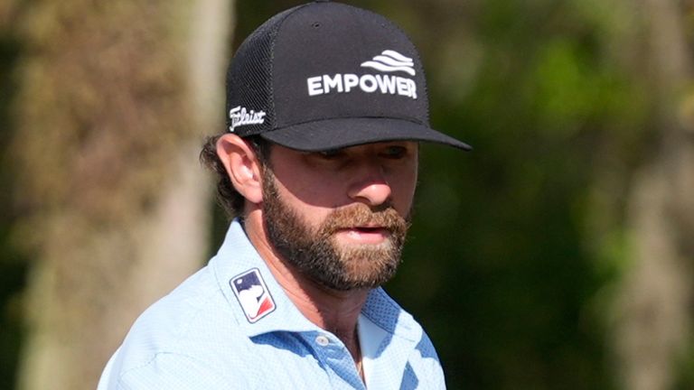 Cameron Young reacts to his putt on the 14th green during the final round of The Players 