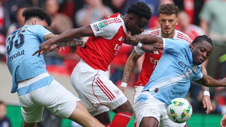 Nico O'Reilly and Jeremy Doku challenge Bukayo Saka 