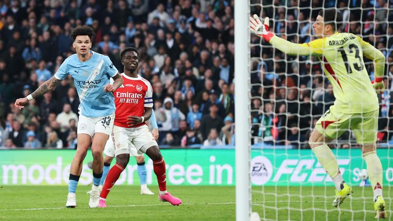 Nico O'Reilly heads Man City into a 2-0 lead against Arsenal in the Carabao Cup final