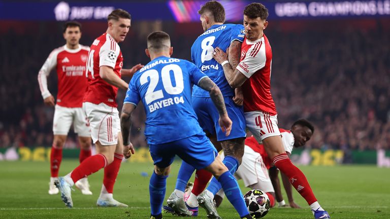 Ben White battles for possession with Alex Grimaldo and Robert Andrich