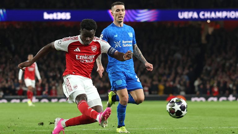 Bukayo Saka gets a shot away against Bayer Leverkusen