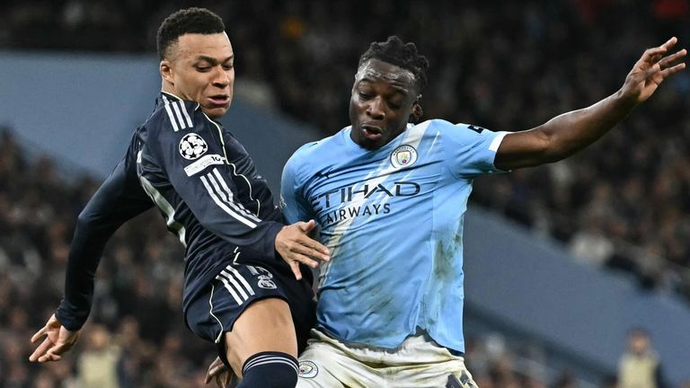 Jeremy Doku vies with Real Madrid substitute Kylian Mbappe