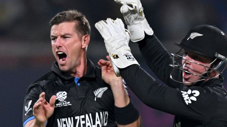 New Zealand's Cole McConchie (L) celebrates with wicketkeeper Tim Seifert after taking the wicket of South Africa's Quinton de Kock during the 2026 ICC Men's T20 Cricket World Cup semi-final match between New Zealand and South Africa at the Eden Gardens in Kolkata on March 4, 2026. (Photo by Arun SANKAR / AFP)