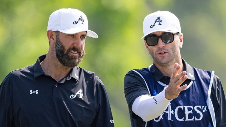 Captain Dustin Johnson of 4Aces GC and his caddie, Gareth Lord, look on during the final round of HSBC LIV Golf Hong Kong 