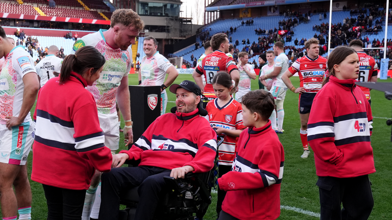 England forward Ollie Chessum in conversation with Ed Slater at full-time