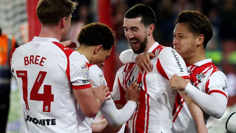 Finn Azaz is congratulated by his team-mates after scoring Southampton's goal against Norwich