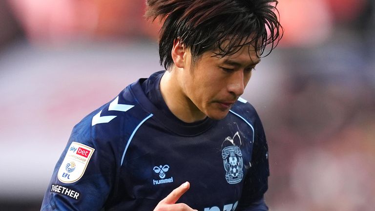 Tatsuhiro Sakamoto celebrates after scoring Coventry's third goal at Swansea