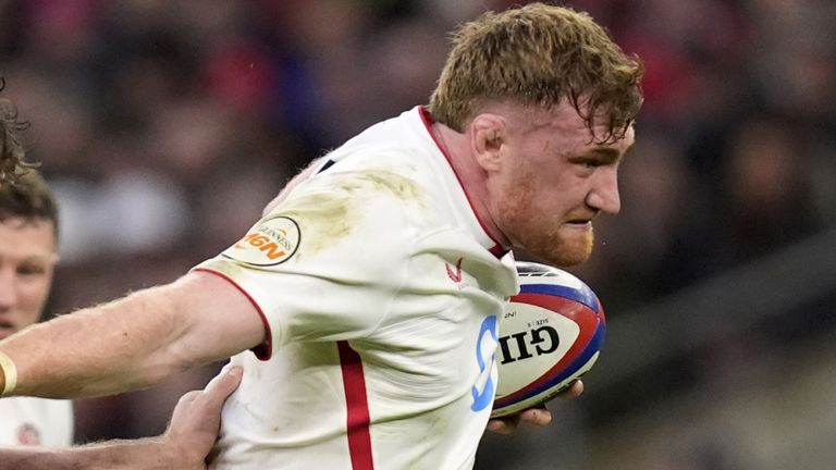 England's Ollie Chessum breaks away from Wales' Eddie James