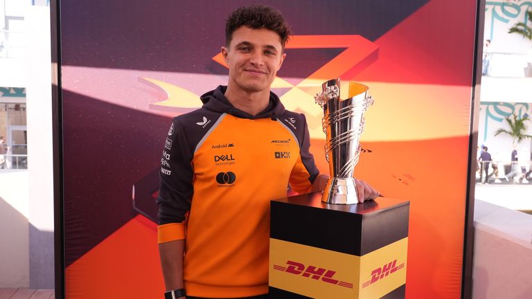 This photo is of Lando Norris with the DHL Fastest Lap award trophy for 2025