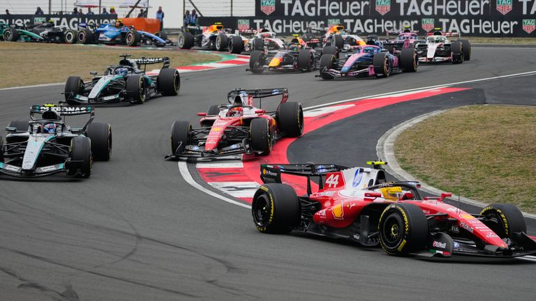 Ferrari driver Lewis Hamilton of Britain steers his car ahead of others during the Chinese Formula One Grand Prix race 
