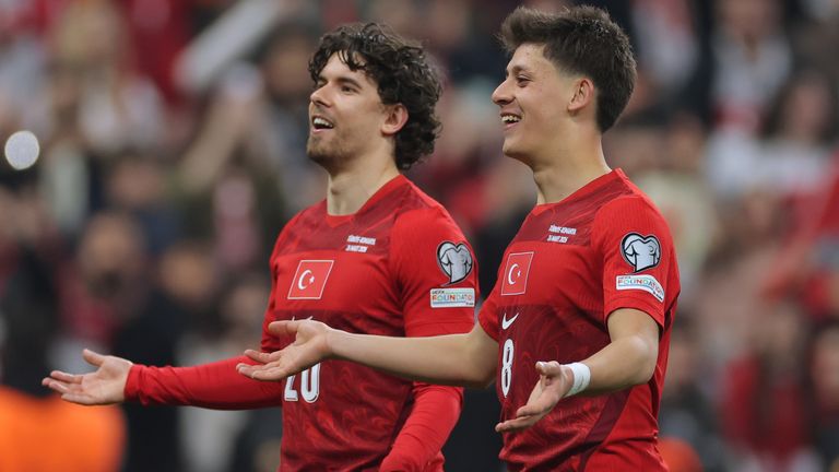 Ferdi Kadioglu and Arda Guler celebrate  the 2026 FIFA World Cup play-off semi-final between Turkey and Romania (AP Photo)