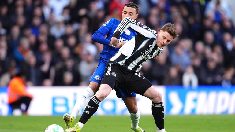 Newcastle United's Harvey Barnes (right) and Chelsea's Malo Gusto battle for the ball