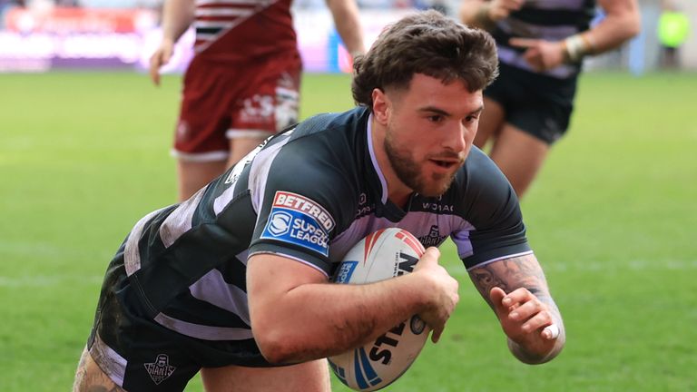 Huddersfield Giants' Connor Wrench scores a try against Wigan