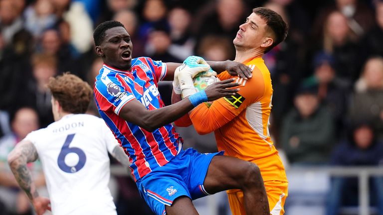Crystal Palace's Ismaila Sarr collides with Leeds United goalkeeper Karl Darlow
