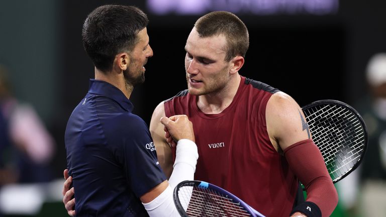 Jack Draper of Great Britain shakes hands at the net after his three set victory against Novak Djokovic of Serbia in their fourth round matc