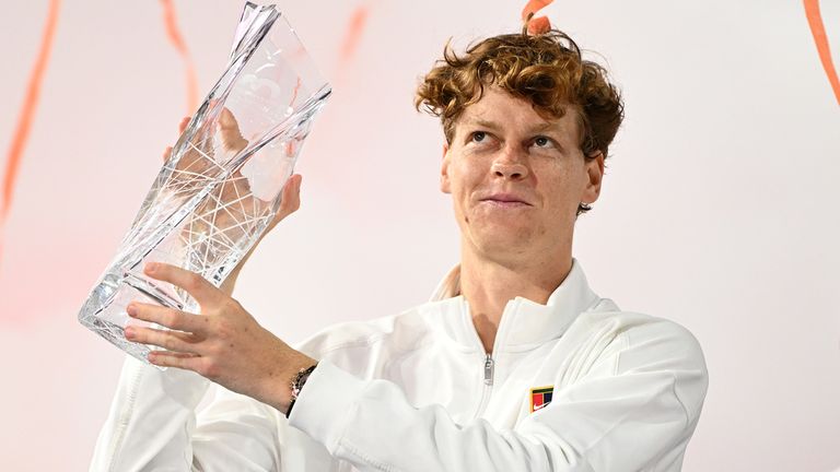Jannik Sinner poses with the championship trophy after defeating Jiri Lehecka during the men's finals at The Miami Open held at Hard Rock St