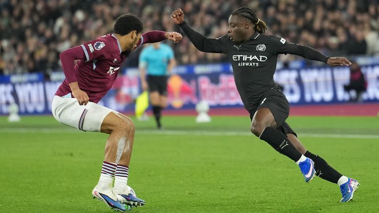 Manchester City's Jeremy Doku and West Ham's Jean-Clair Todibo compete for the ball (AP Photo/Dave Shopland)