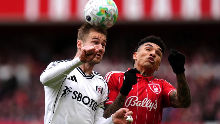 Fulham's Joachim Andersen (left) and Nottingham Forest's Igor Jesus compete for a header