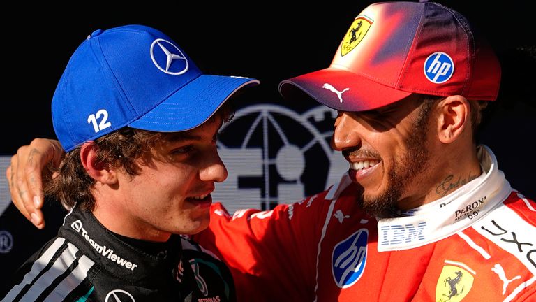 Mercedes driver Andrea Kimi Antonelli, left, of Italy is greeted by Ferrari driver Lewis Hamilton of Britain after getting the pole position during the qualifying session of the Chinese Formula One Grand Prix at the Shanghai International Circuit, in