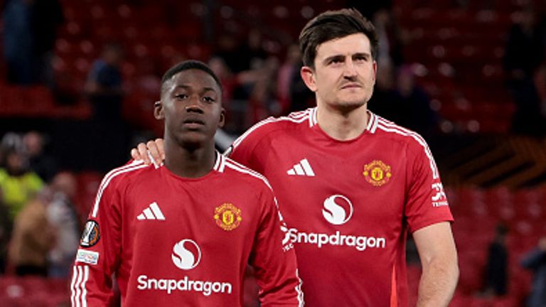 MANCHESTER, ENGLAND - APRIL 17: Kobbie Mainoo, Harry Maguire of Manchester United celebrate the victory following the UEFA Europa League 2024/25 Quarter Final Second Leg football match between Manchester United (Man U) and Olympique Lyonnais (OL, Lyon) at Old Trafford  stadium on April 17, 2025 in Manchester, England. (Photo by Jean Catuffe/Getty Images)